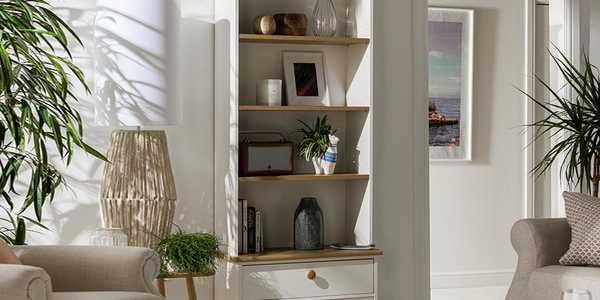 Grey wooden bookcasewith accessories in home.